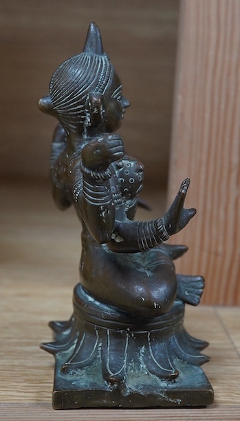 An Indian bronze tantric figure, 14cm high. Condition - fair to good